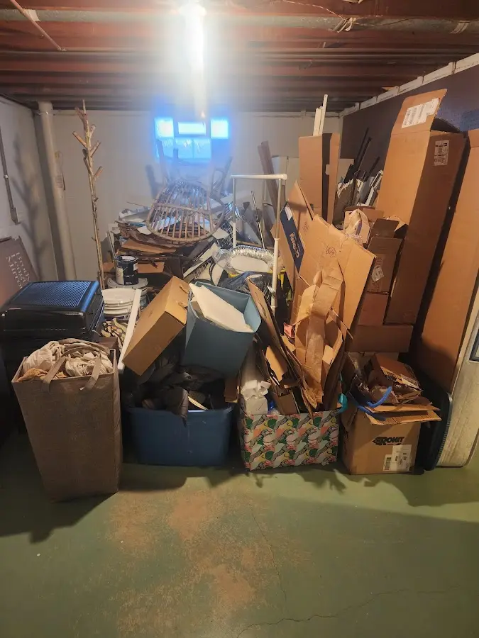 Roll-off dumpster container at job site for 2 Yard Dumpster Rental in Waynesville